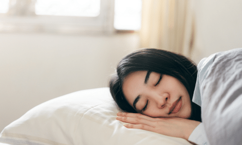 woman taking a nap in the middle of the day instead of eating without hunger